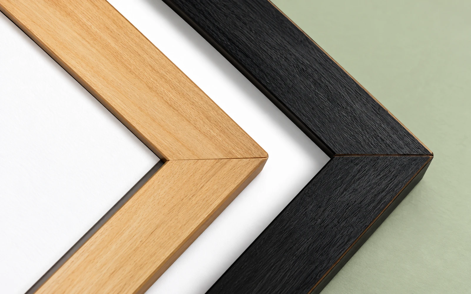 Unfinished pine and black stained frame corners side by side