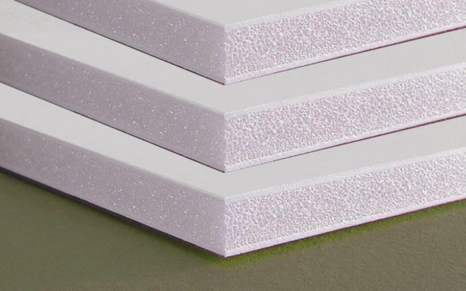 Three mounting board samples stacked to show their cut edges