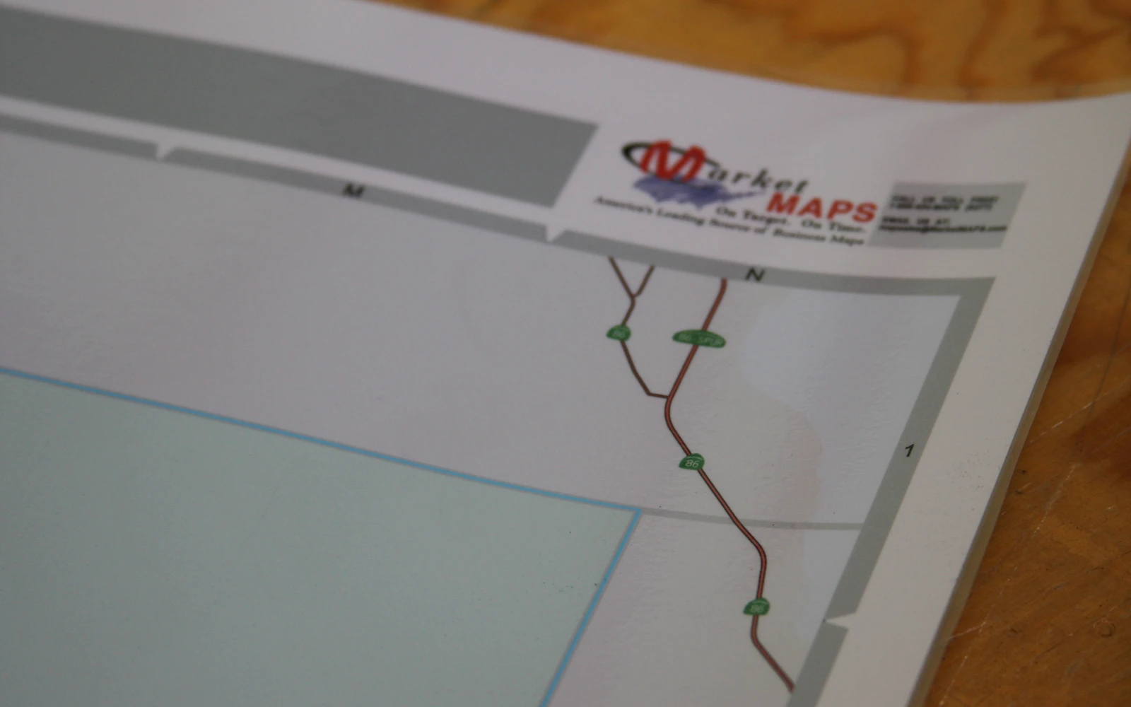 A matte laminated map seen at an angle, still free of glare