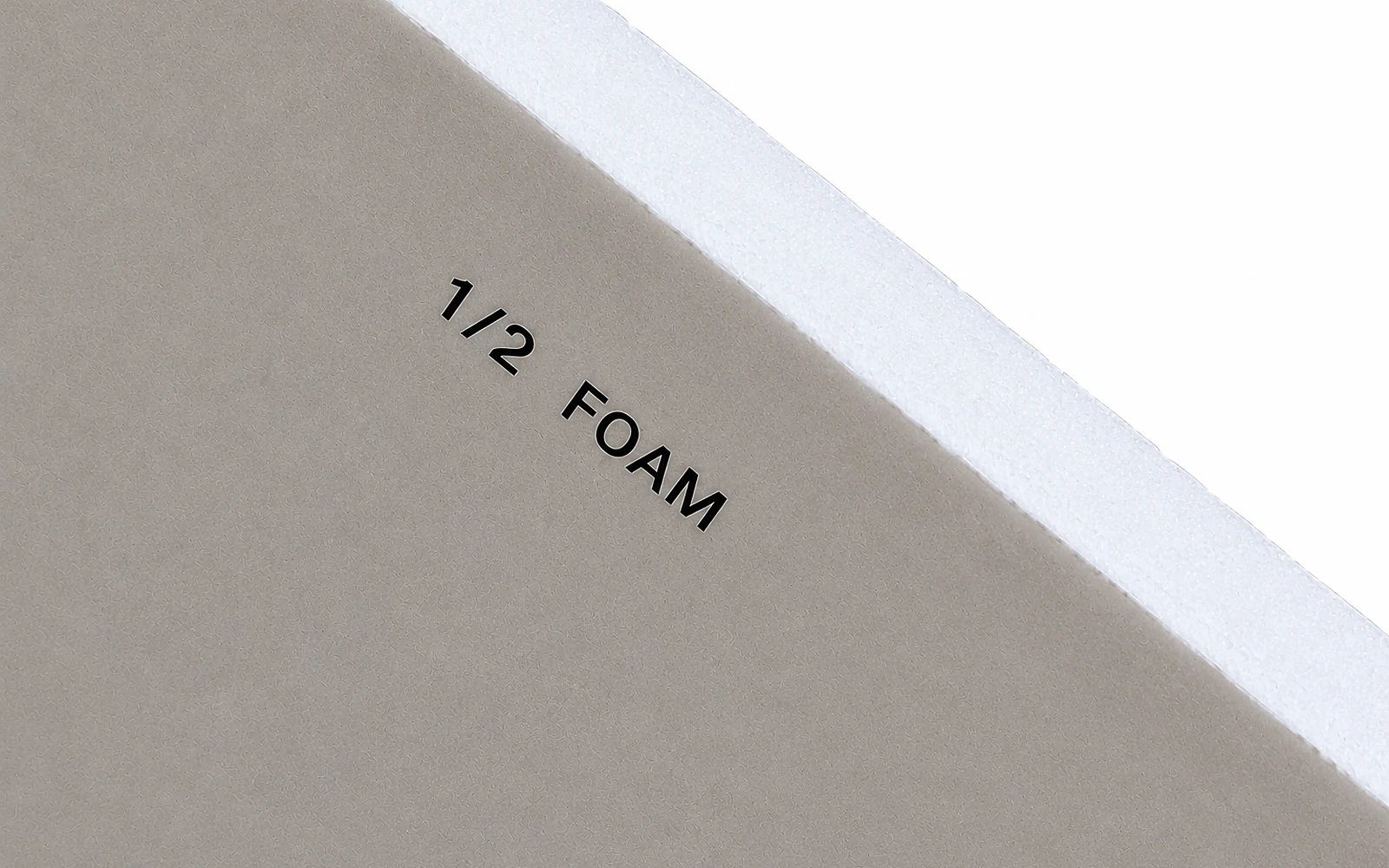 The cut corner of a board labelled 1/2 FOAM, noticeably thicker