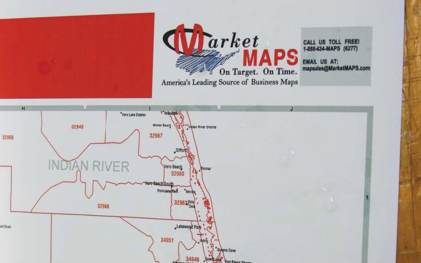 A synthetic paper map displayed flat, showing its matte non-glare surface