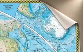 A large map sheet with one corner lifting away from the wall